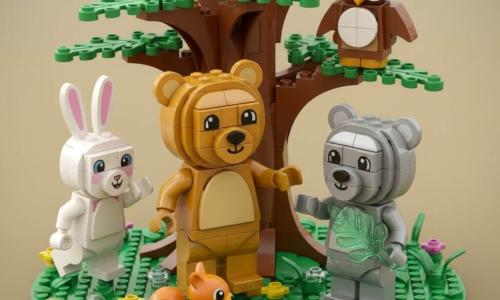 A LEGO diorama of a golden-brown teddy bear named Benny smiling and offering his paw to a shy, happy silver-furred bear named Luna holding a sparkling leaf, joined by a white-eared rabbit Tilly clapping as she hops left, a wise brown-and-white owl Leo perched on a low oak branch, and a curious red squirrel picking a colorful pebble in a sunny clearing with a large green-leafed LEGO oak, textured grass, multicolored flowers and scattered shiny pebbles; the characters form a warm, colorful circle of sharing and welcome, with saturated colors, visible brick textures and soft golden afternoon lighting centered on Benny and Luna.